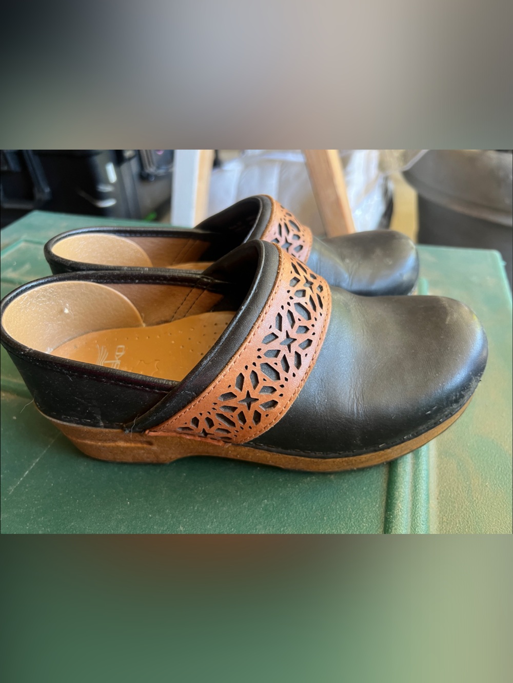 Dansko Black Leather Clogs with Brown Laser-Cut Strap